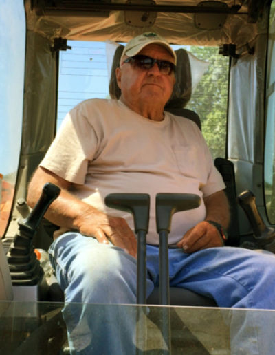 Man sitting in tractor.